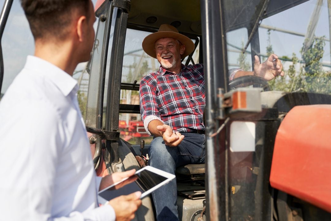 a farmer in a tractor